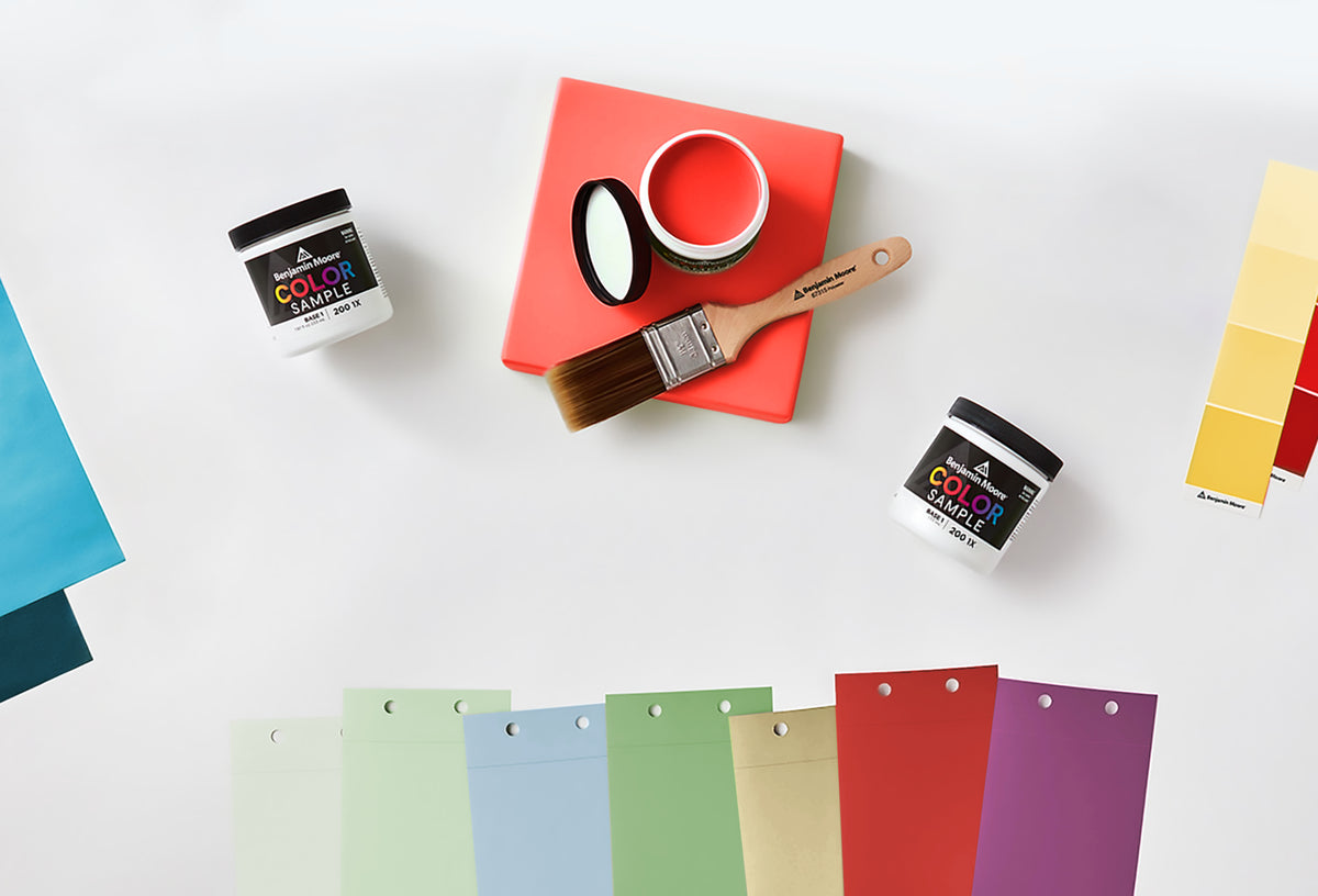 Benjamin Moore paint color samples with a rainbow of paper swatches on a white background